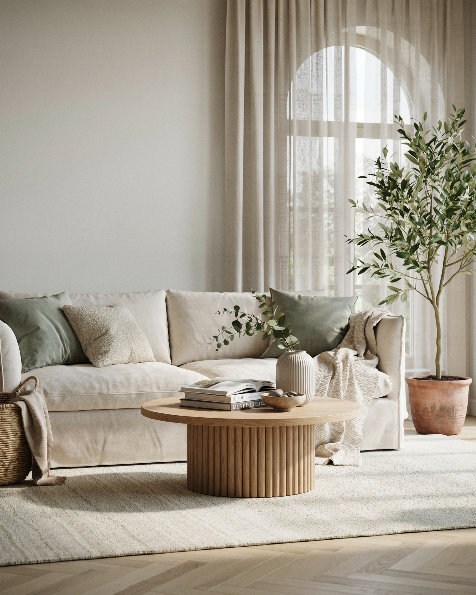 Sunlit modern living room styled in sage green and ivory